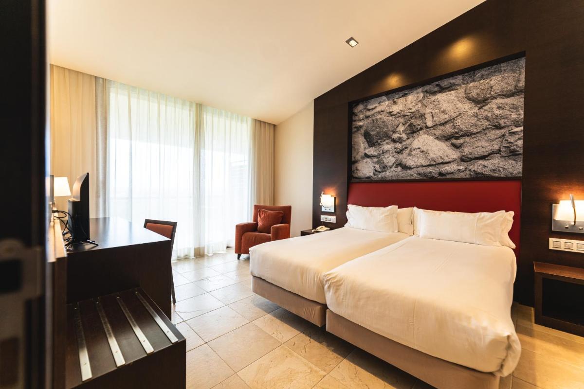 Cama o camas de una habitación en Hotel Mas Solà