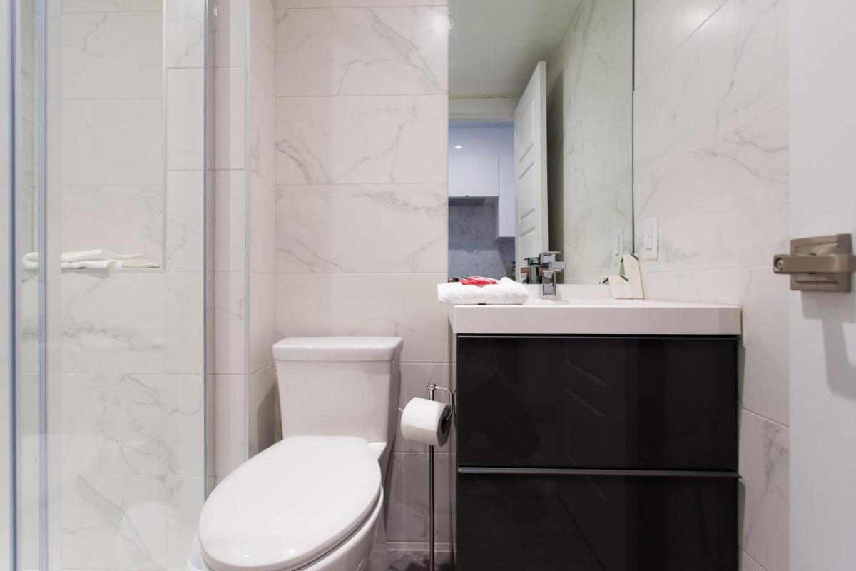 Studio Palms Steps from JeanTalon Market Full Bath by Den Stays - Housity