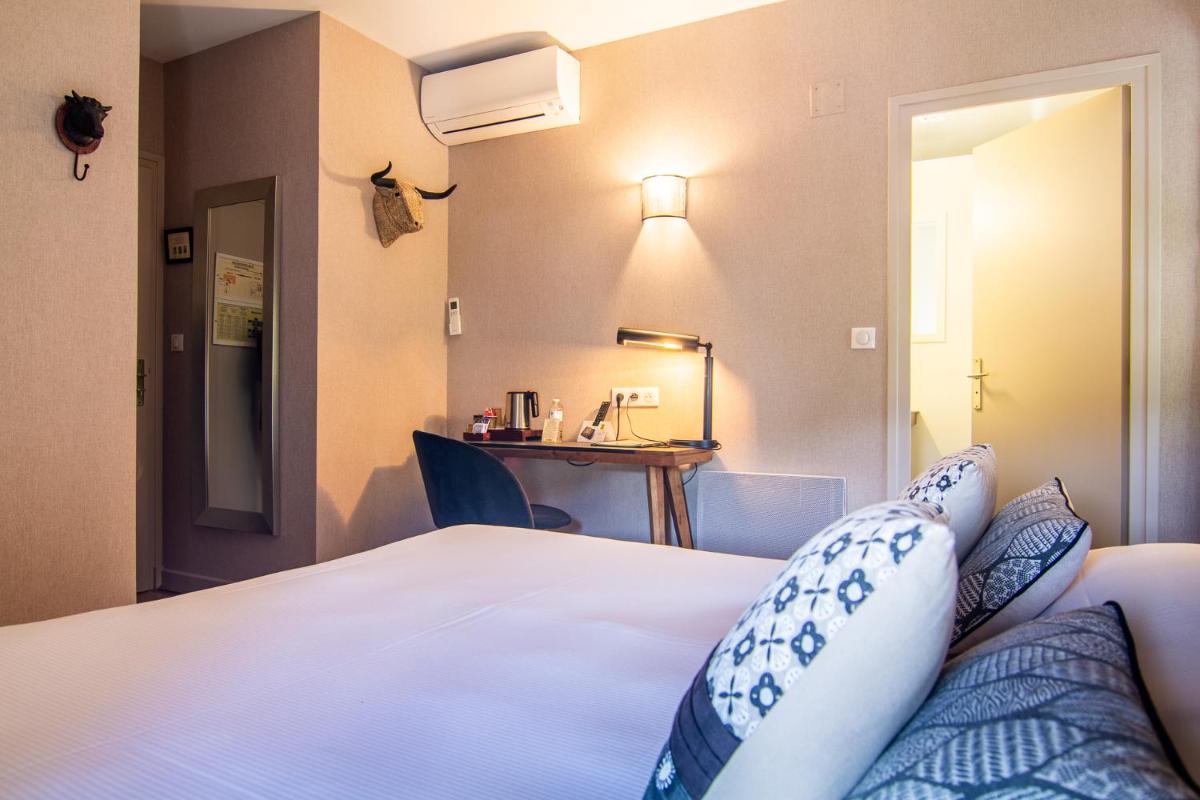 Un ou plusieurs lits dans un hébergement de l'établissement Hôtel Spa La Truite Dorée