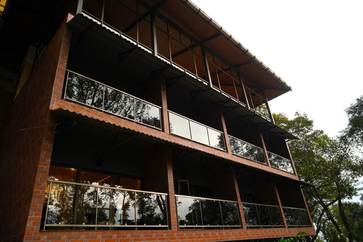 a building with balconies on the side of it at Elephant Passage in Munnar