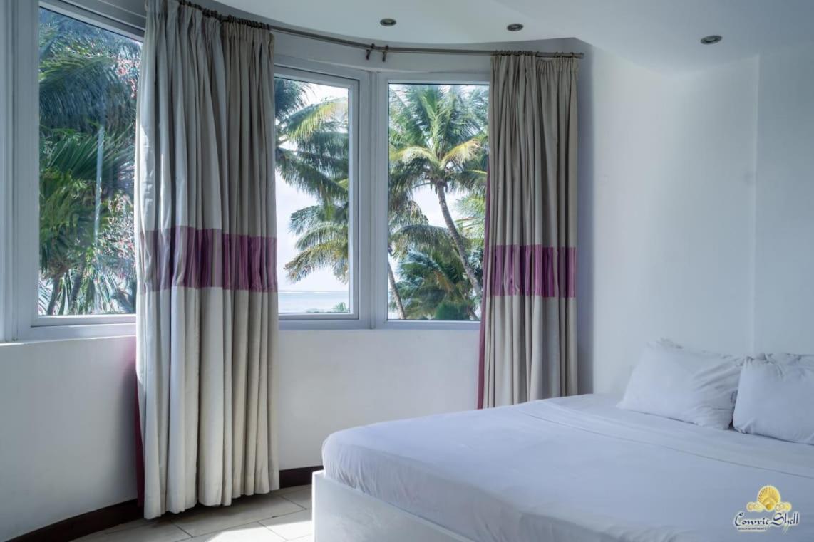 Rosy Sea Front Beach Condo - Housity