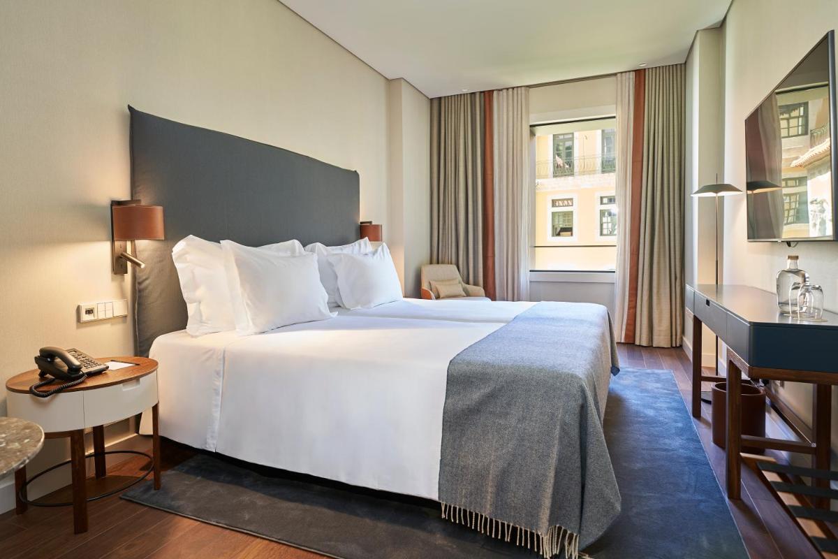Uma cama ou camas num quarto em PortoBay Flores
