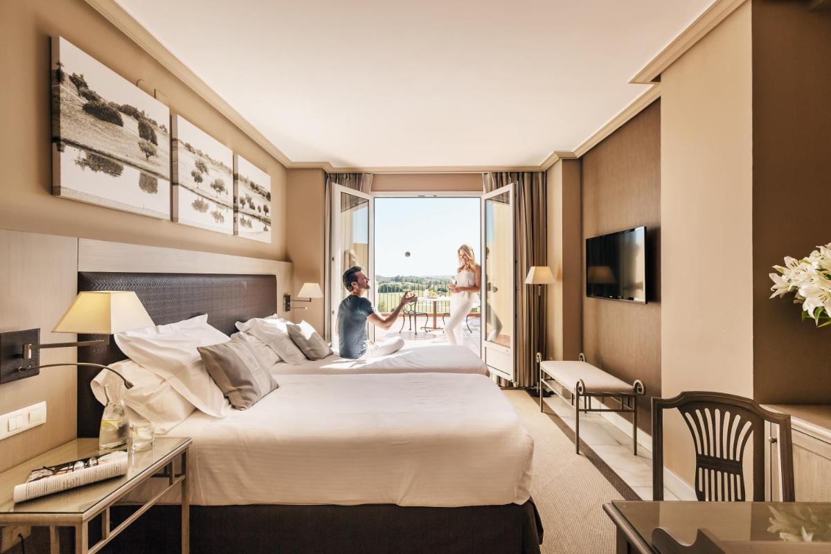 Cama o camas de una habitación en Barceló Montecastillo Golf