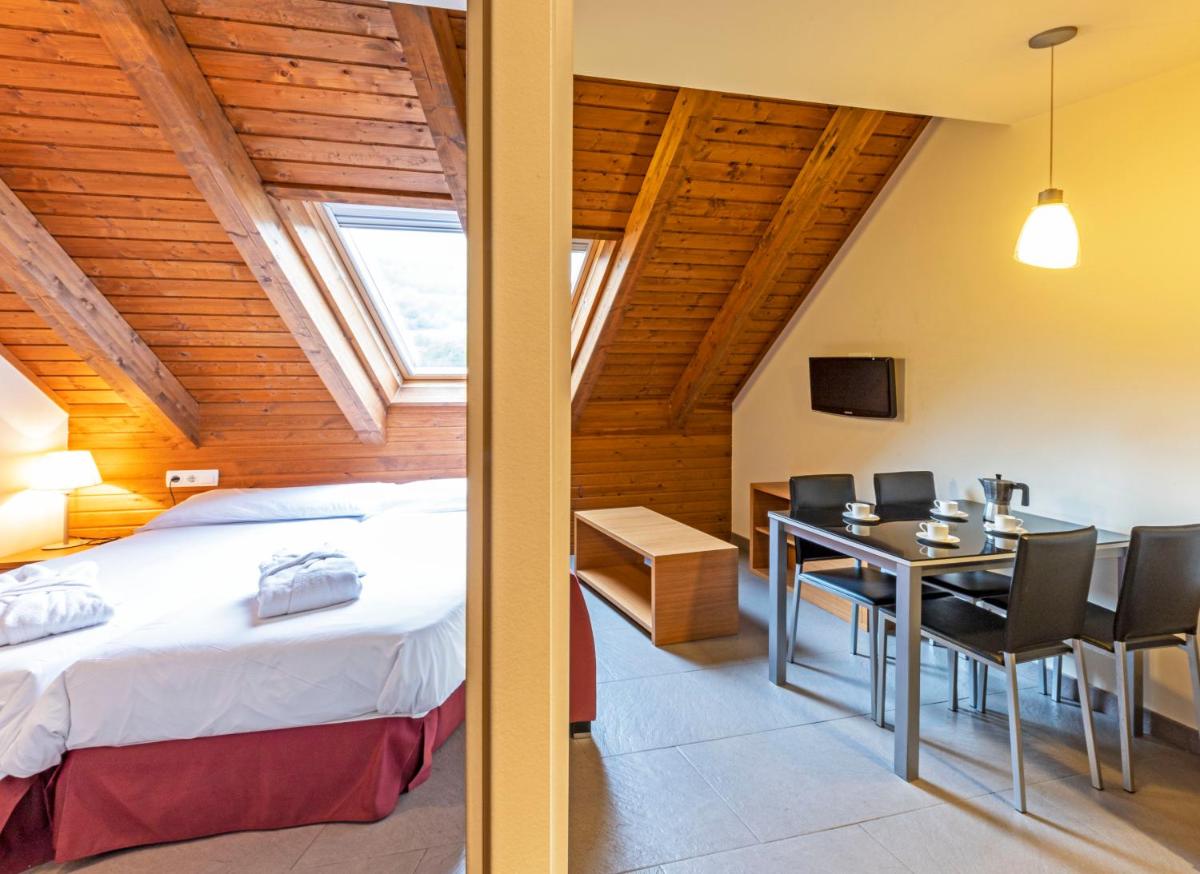 Cama o camas de una habitación en Aparthotel Trainera