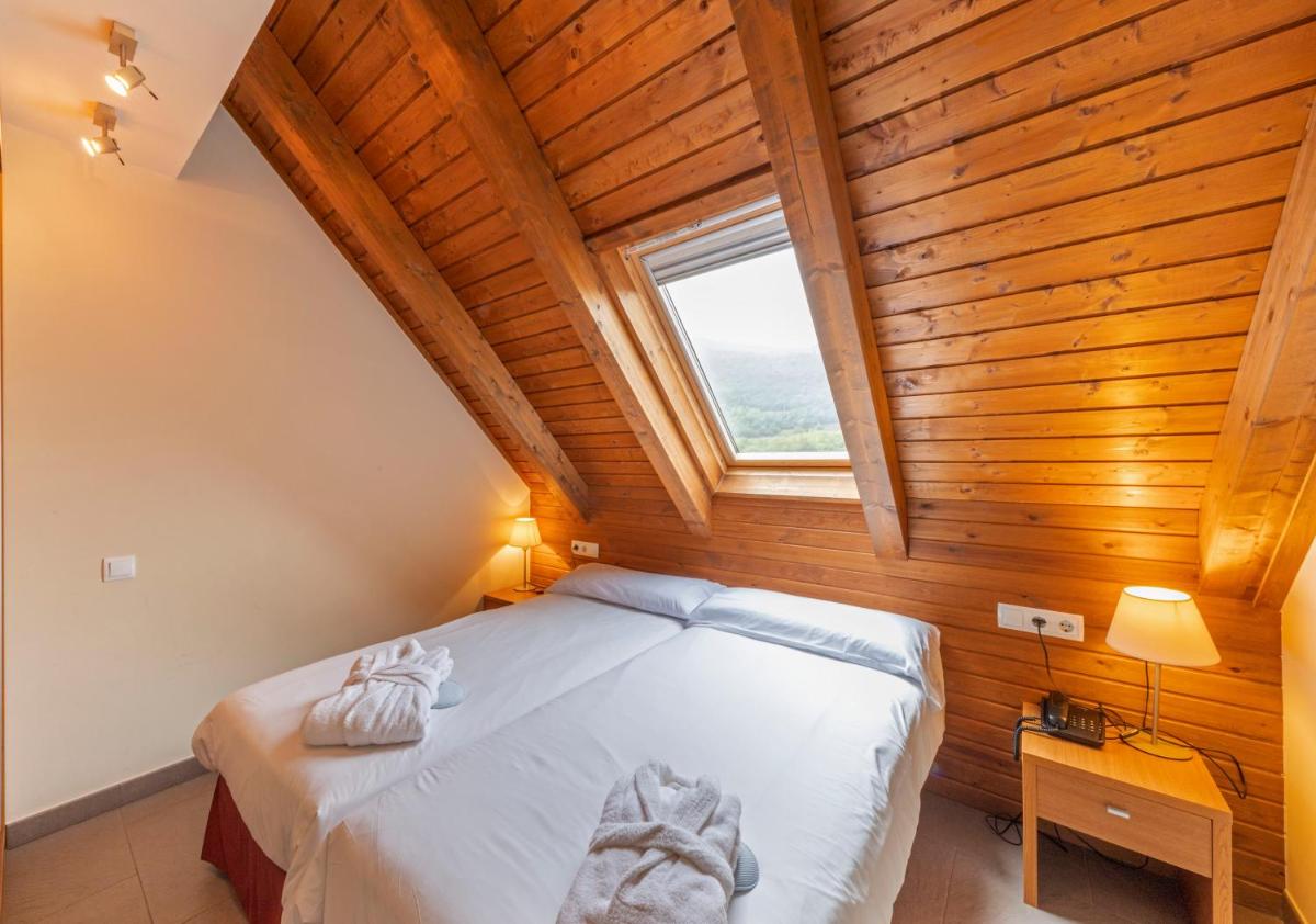Cama o camas de una habitación en Aparthotel Trainera
