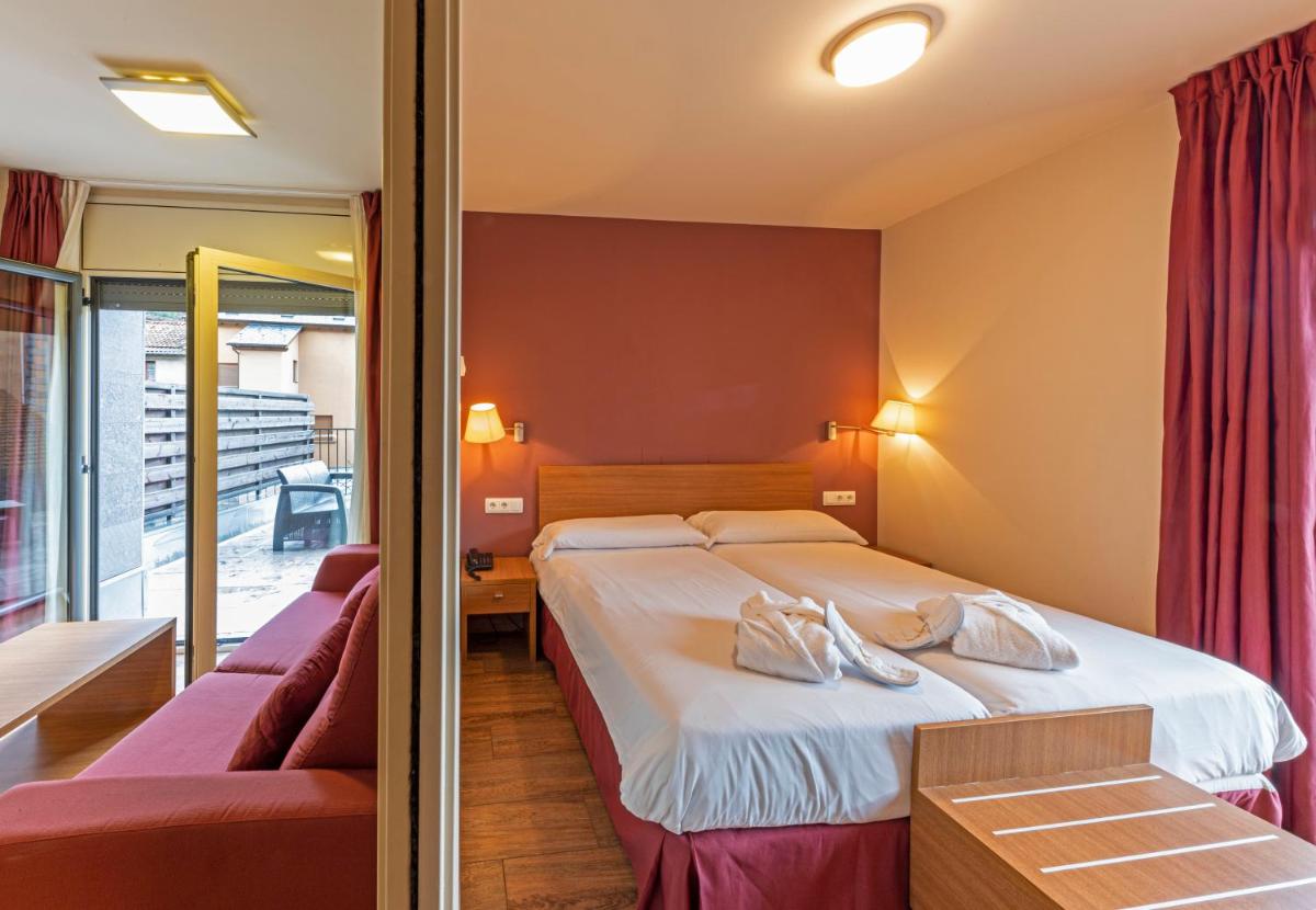 Cama o camas de una habitación en Aparthotel Trainera