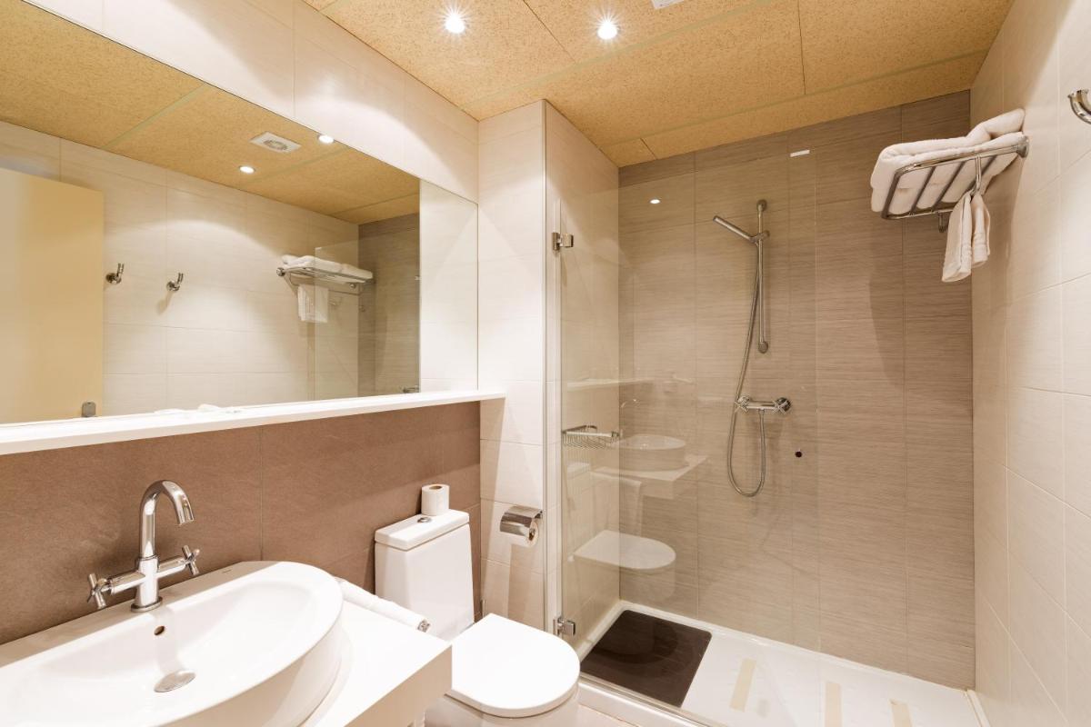Un baño de Aparthotel Trainera