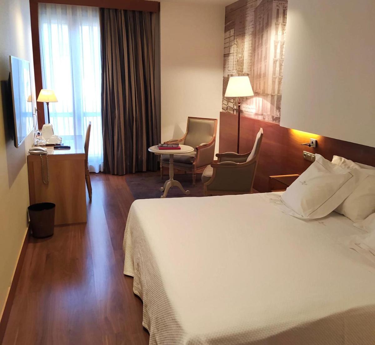 Cama o camas de una habitación en Gran Hotel La Perla