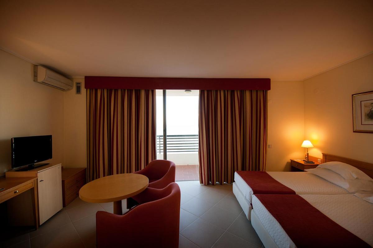 Uma cama ou camas num quarto em Vila Gale Ampalius