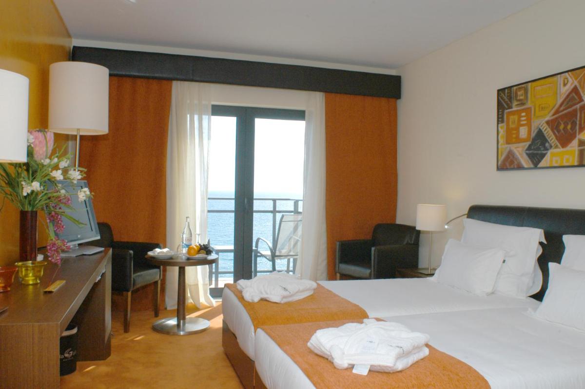 Uma cama ou camas num quarto em Vila Gale Santa Cruz