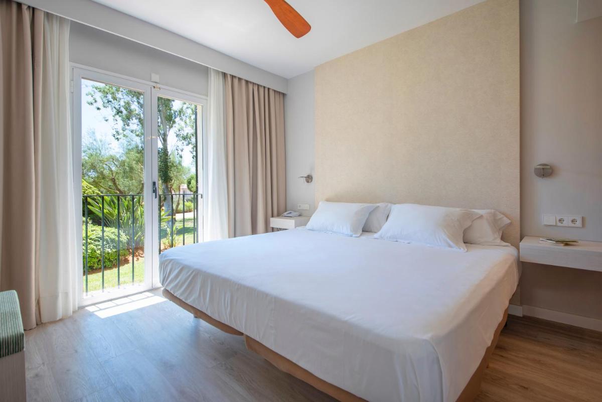 Cama o camas de una habitación en Blau Colònia Sant Jordi