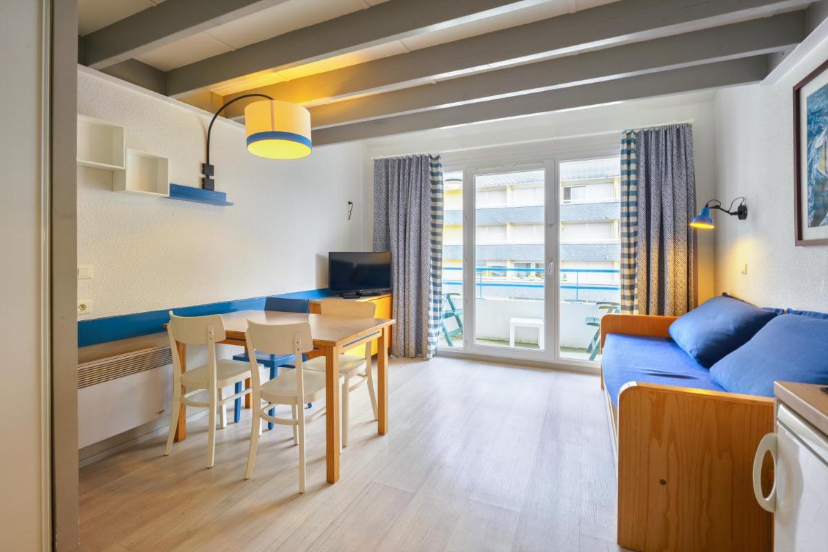 Coin salon dans l'établissement Résidence Pierre & Vacances la Corniche de la Plage