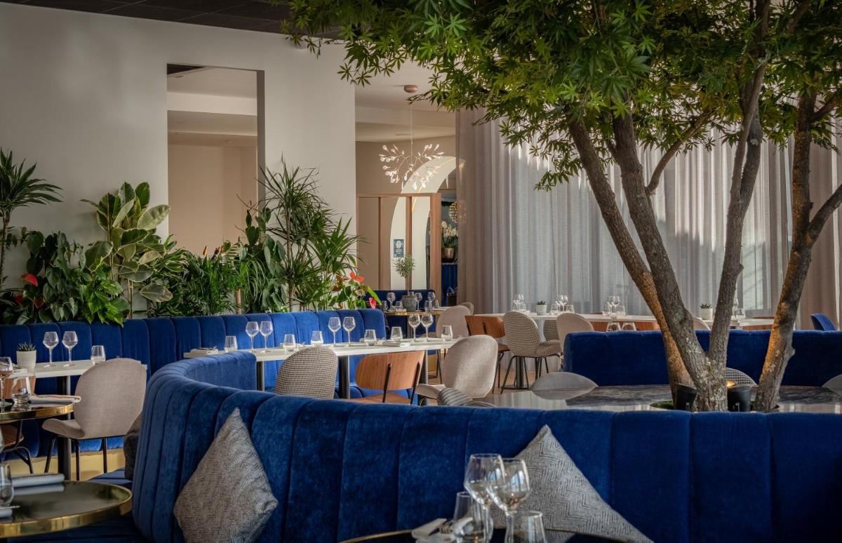 Restaurant ou autre lieu de restauration dans l'établissement GOLDEN TULIP LYON OUEST TECHLID Hotel & Spa