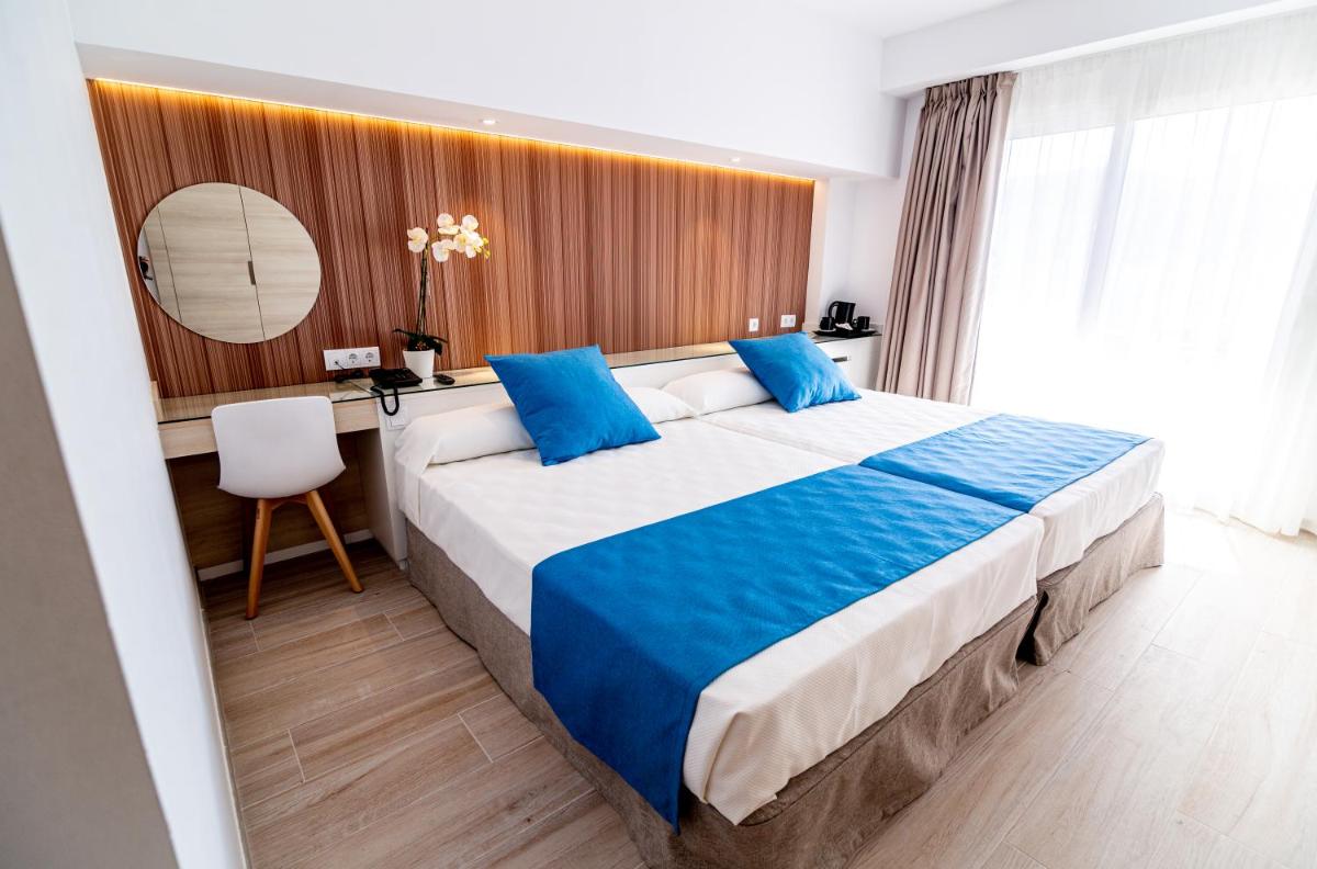 Cama o camas de una habitación en Hotel Rosamar