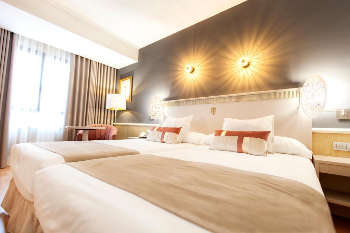 Cama o camas de una habitación en Hotel Alfonso VIII