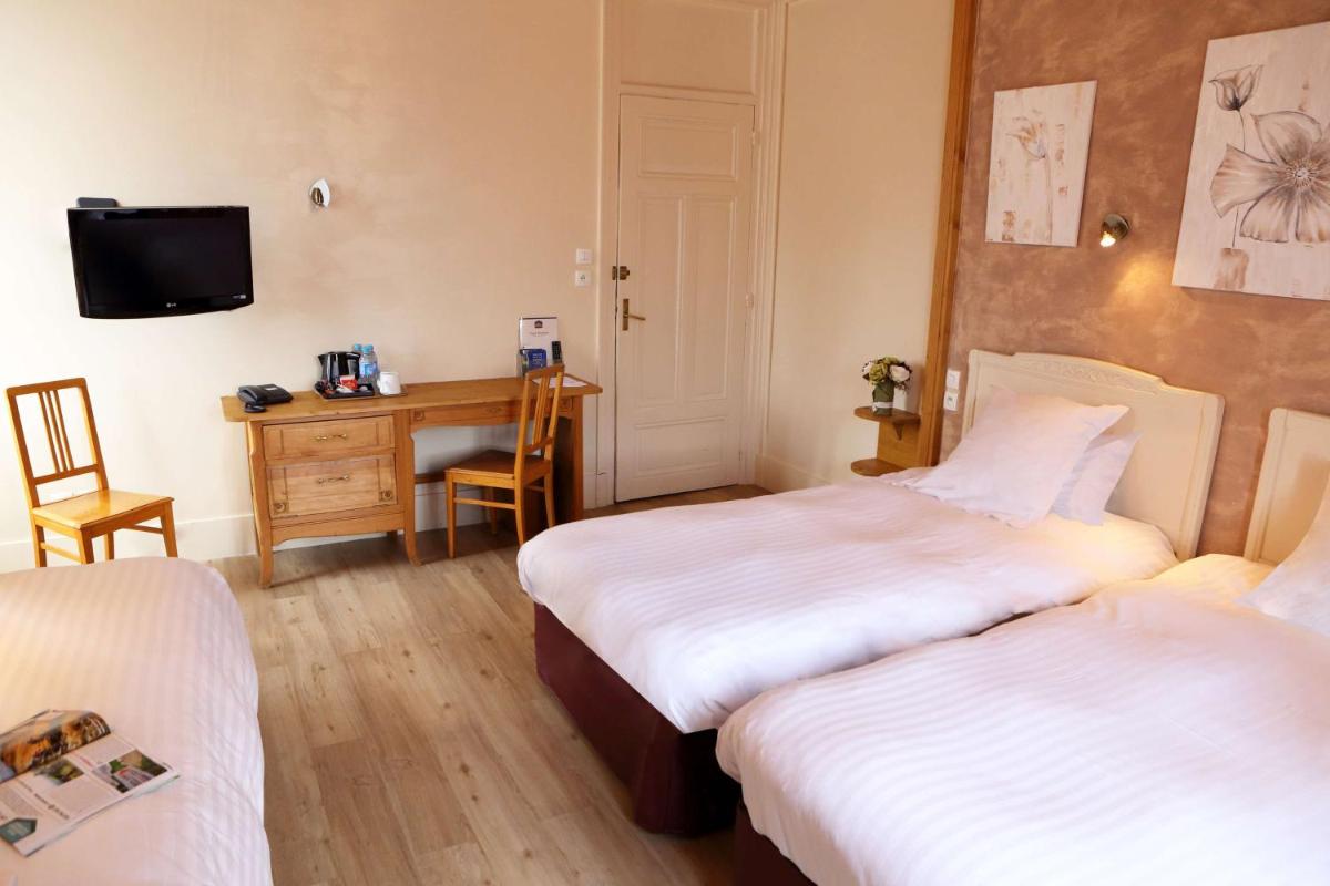 Un ou plusieurs lits dans un hébergement de l'établissement Best Western Grand Hotel de Paris & Spa