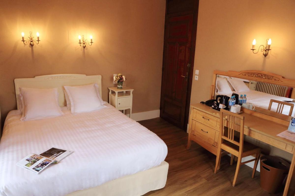 Un ou plusieurs lits dans un hébergement de l'établissement Best Western Grand Hotel de Paris & Spa