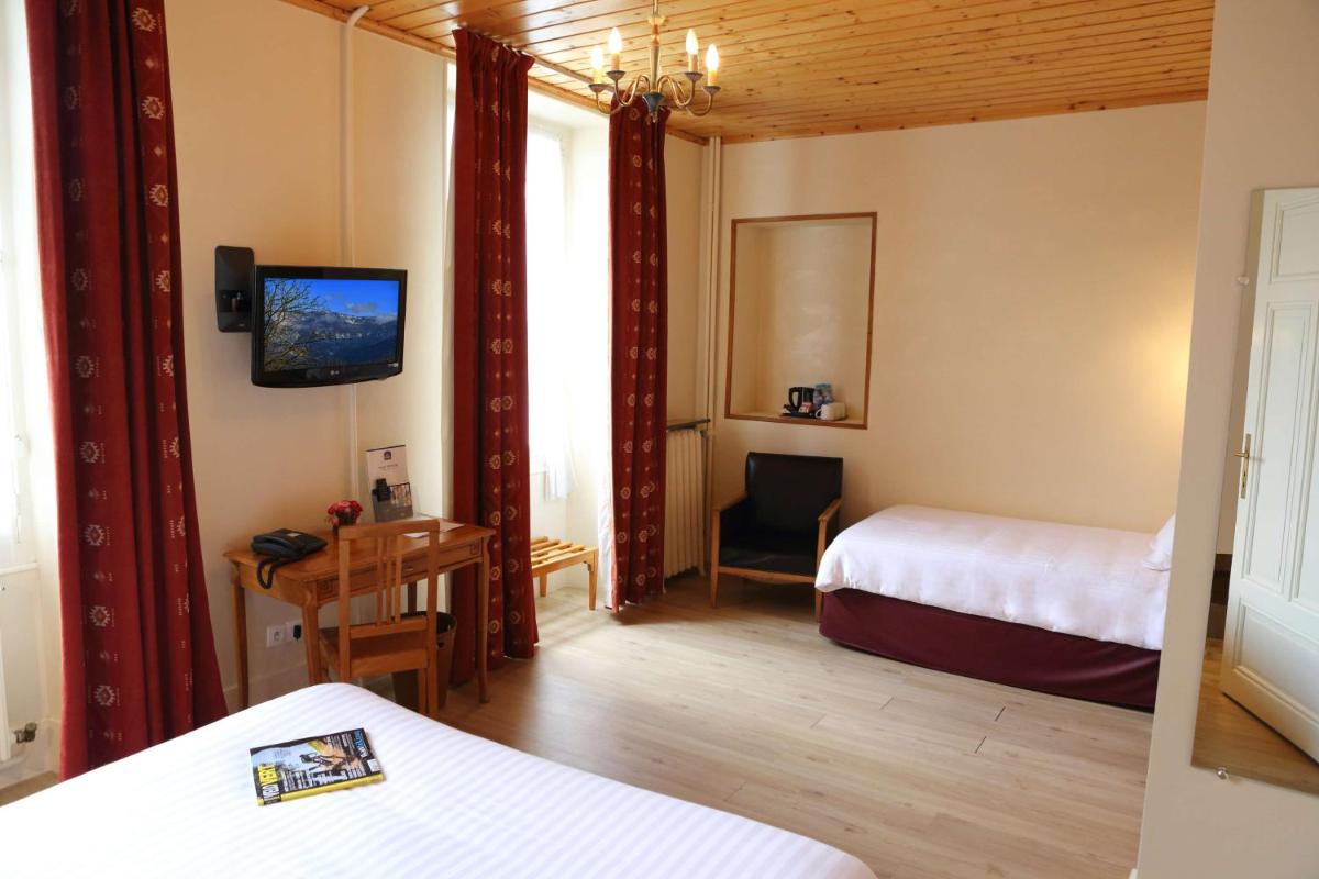 Un ou plusieurs lits dans un hébergement de l'établissement Best Western Grand Hotel de Paris & Spa