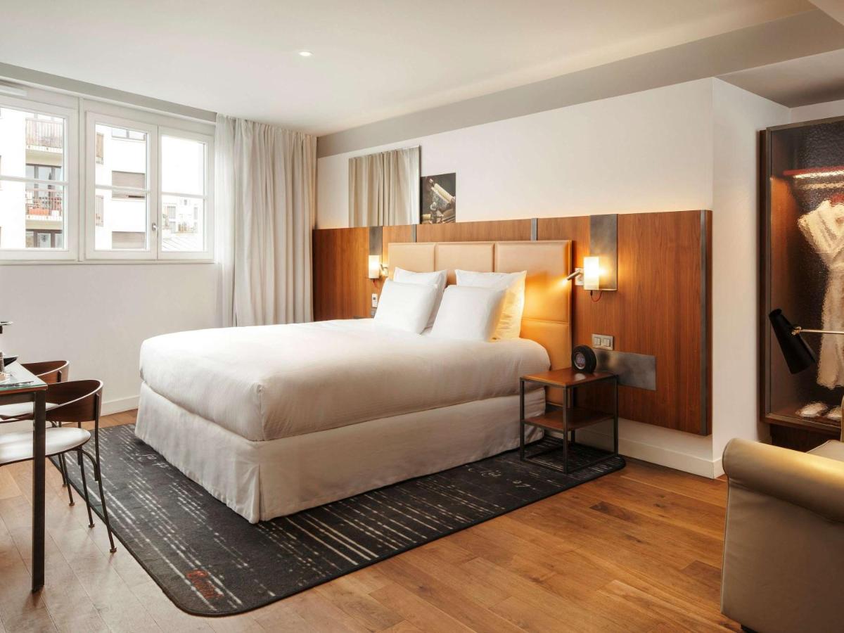 Un ou plusieurs lits dans un hébergement de l'établissement Boutet Bastille Hotel Paris - MGallery Collection