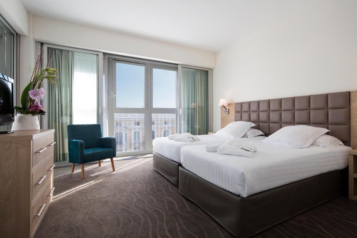 Un ou plusieurs lits dans un hébergement de l'établissement Splendid Hotel & Spa Nice