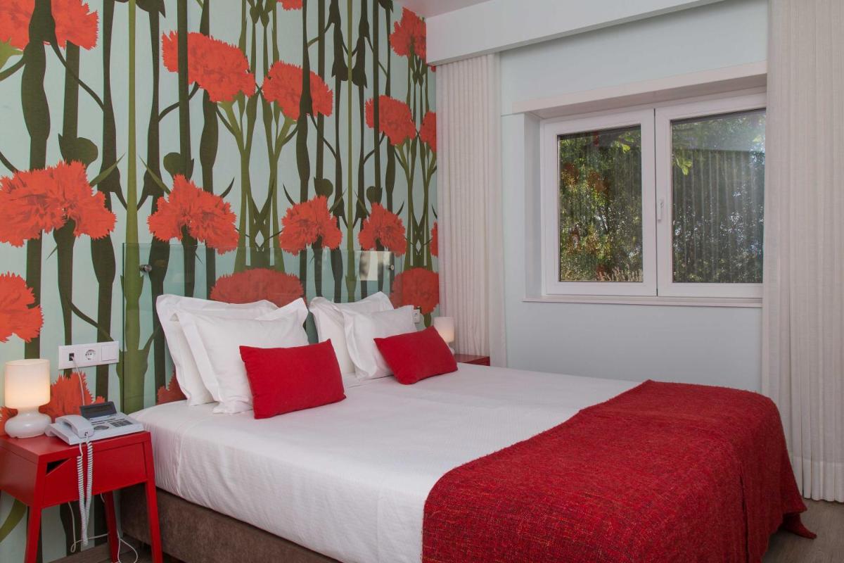 Uma cama ou camas num quarto em Aires da Serra Hotel