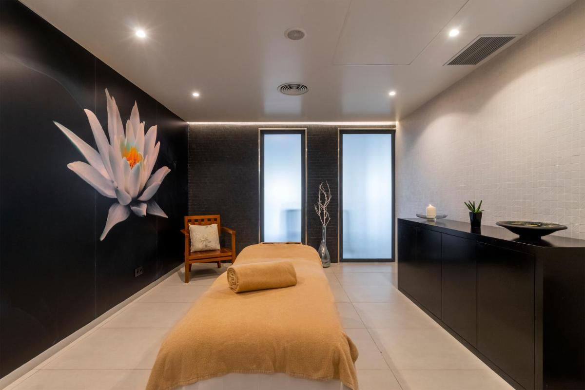 Uma cama ou camas num quarto em Enotel Lido - All Inclusive