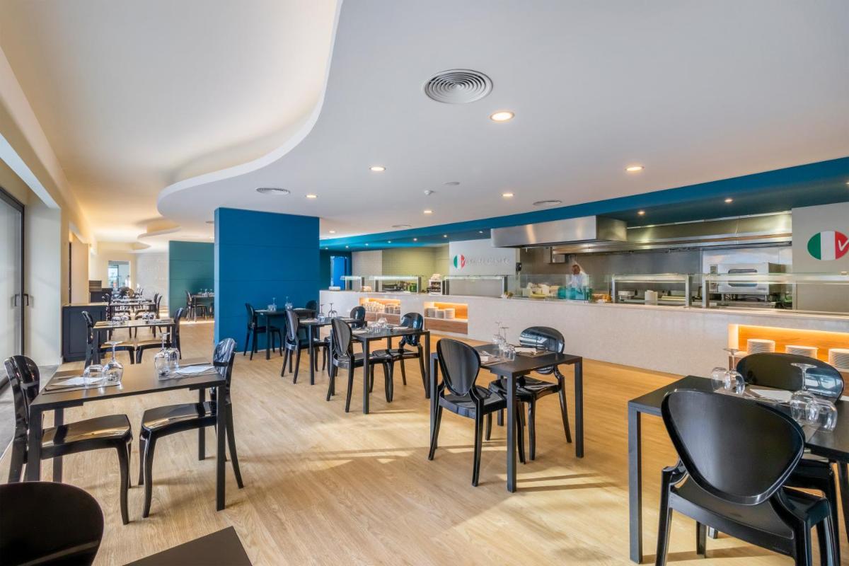 Um restaurante ou outro lugar para comer em Enotel Lido - All Inclusive