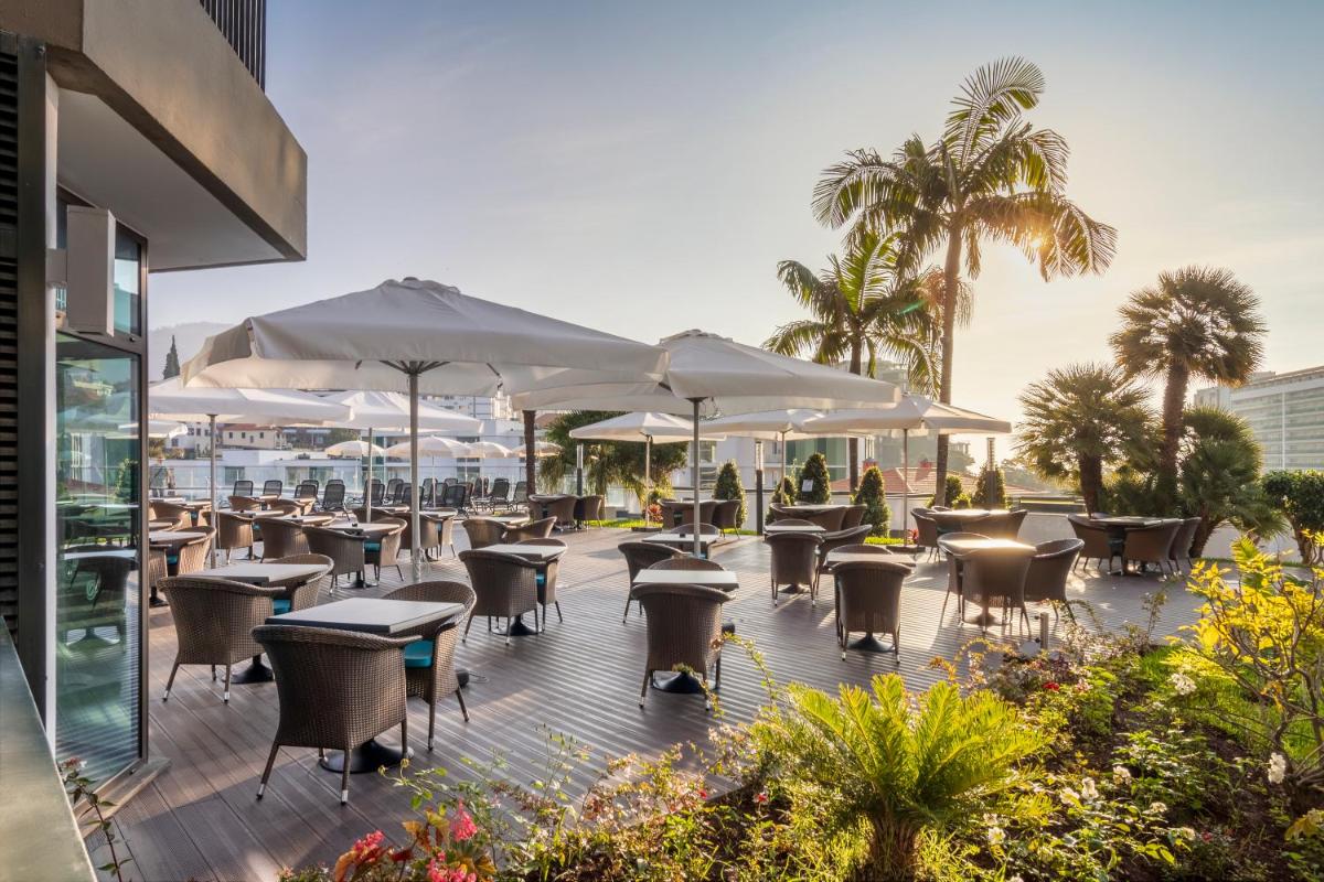 Um restaurante ou outro lugar para comer em Enotel Magnólia