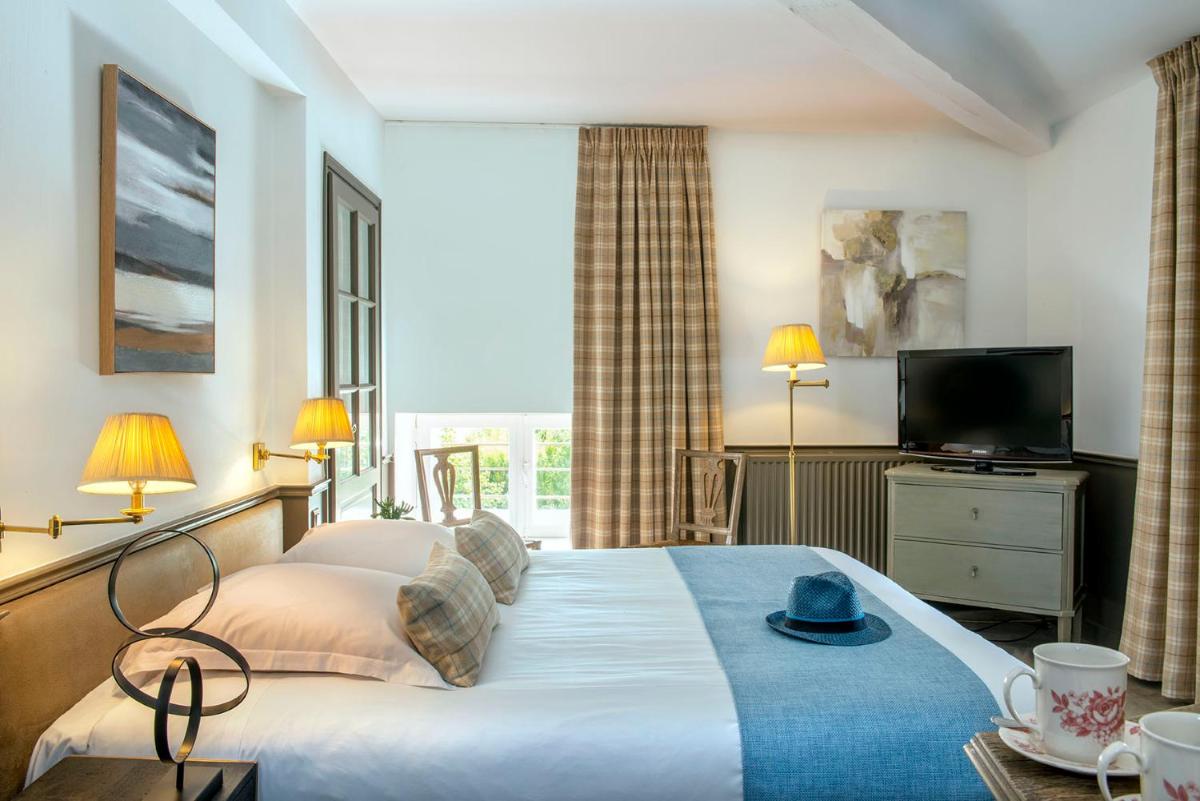 Un ou plusieurs lits dans un hébergement de l'établissement Château de Courban and Spa Nuxe
