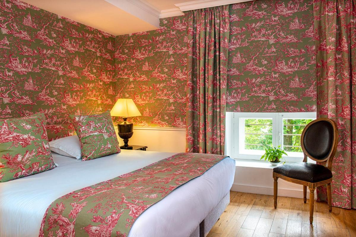 Un ou plusieurs lits dans un hébergement de l'établissement Château de Courban and Spa Nuxe