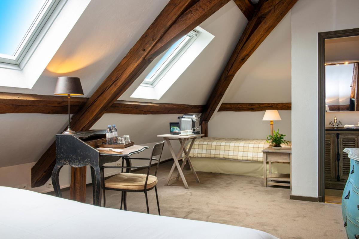 Un ou plusieurs lits dans un hébergement de l'établissement Château de Courban and Spa Nuxe