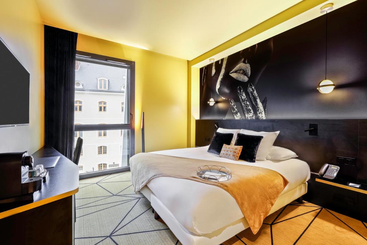 Un ou plusieurs lits dans un hébergement de l'établissement Hotel Leprince, Best Western Premier Collection