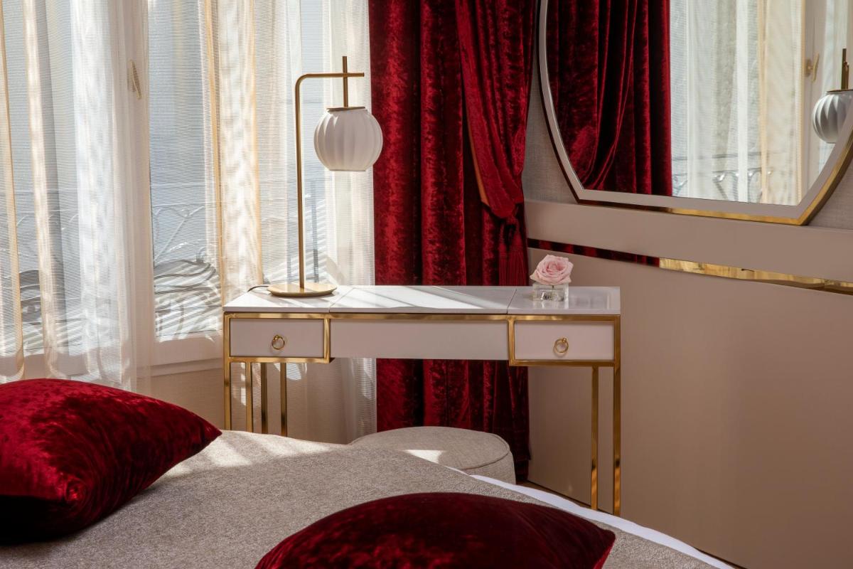 Un ou plusieurs lits dans un hébergement de l'établissement Paris j'Adore Hotel & Spa