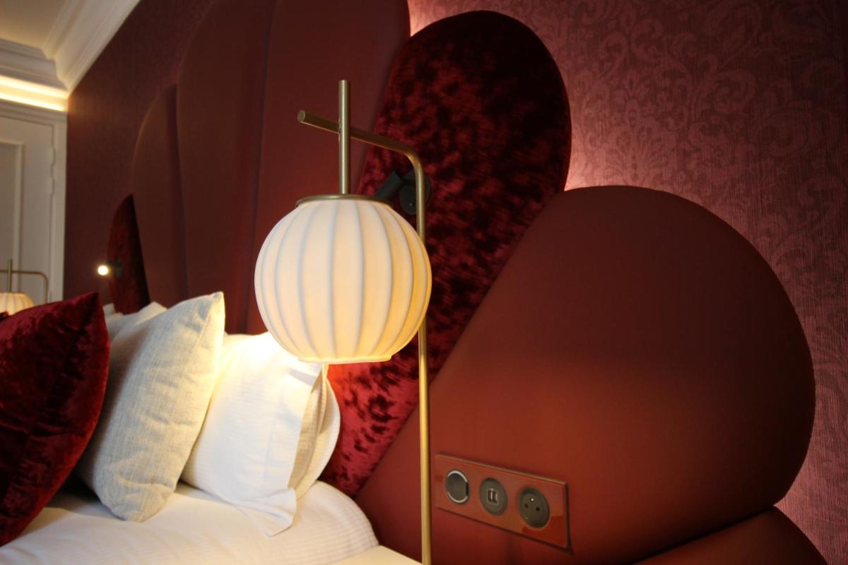 Un ou plusieurs lits dans un hébergement de l'établissement Paris j'Adore Hotel & Spa