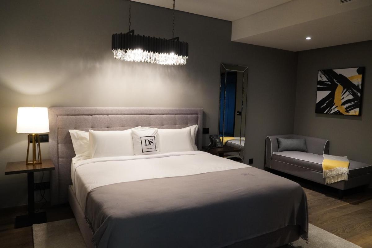Uma cama ou camas num quarto em DS Hotel Lusopark