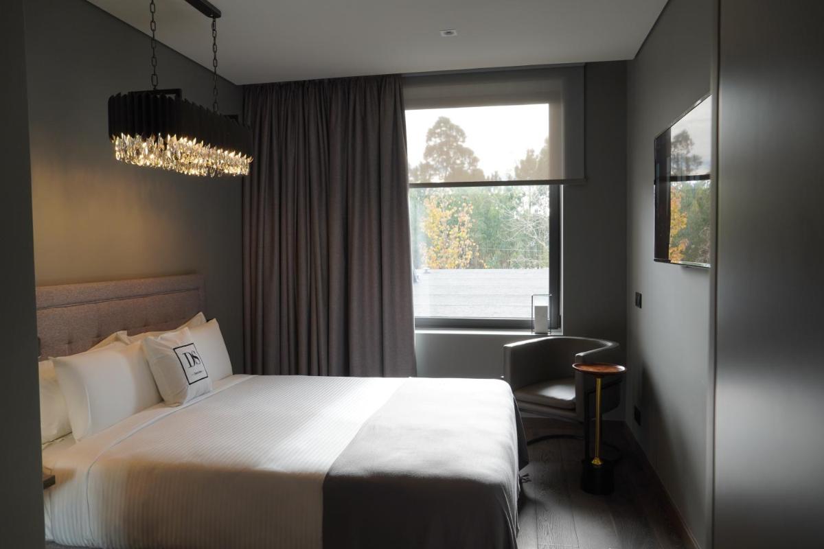 Uma cama ou camas num quarto em DS Hotel Lusopark