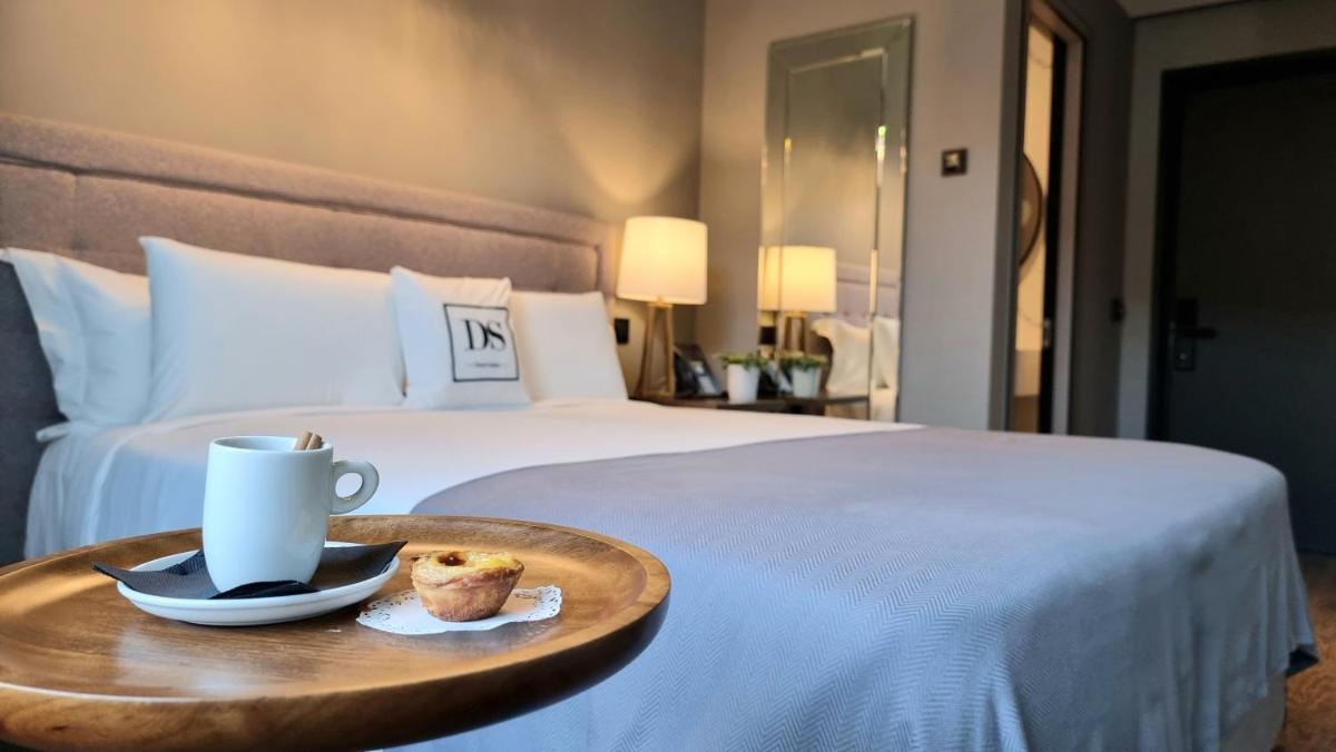 Uma cama ou camas num quarto em DS Hotel Lusopark