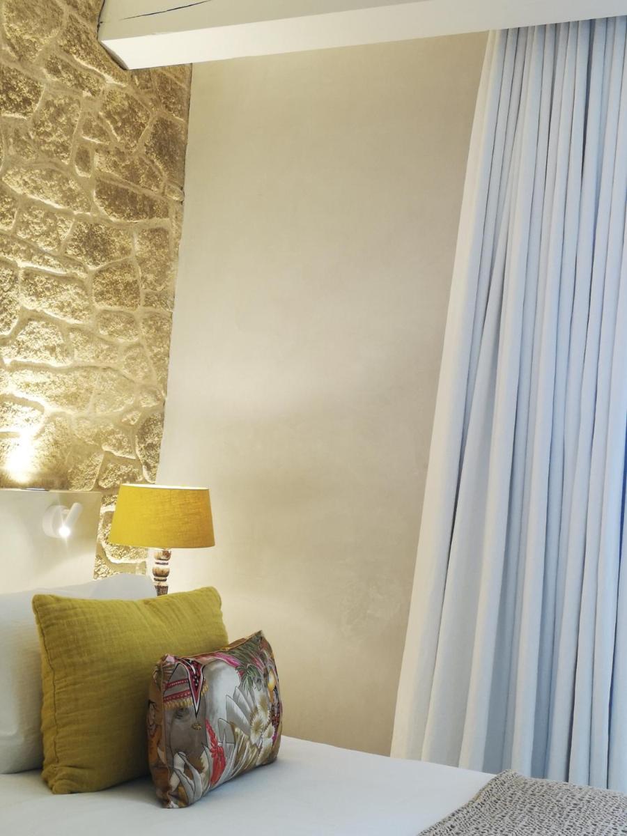 Un ou plusieurs lits dans un hébergement de l'établissement Hôtel La Dimora & Spa