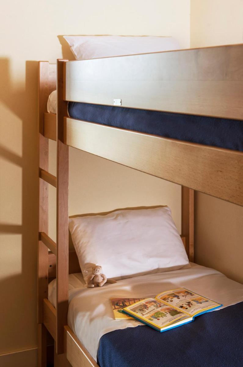 Un ou plusieurs lits dans un hébergement de l'établissement Résidence Valdys Thalasso & Spa - les Pins