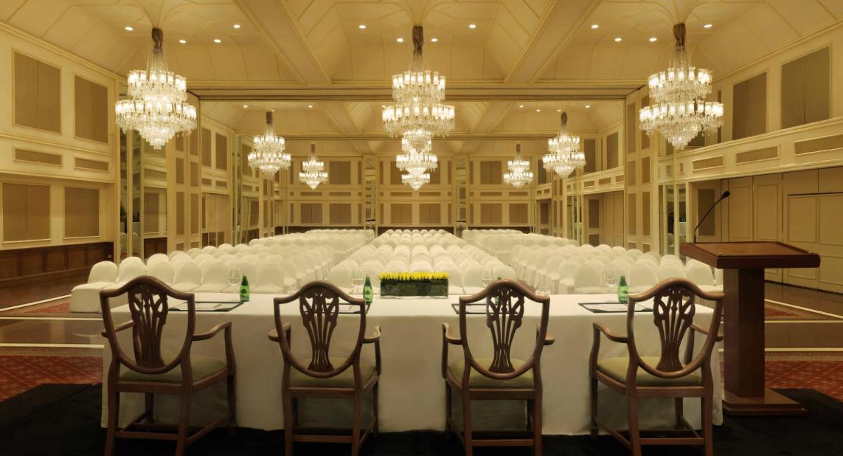 a large conference room with a table and chairs at Trident Nariman Point in Mumbai a large conference room with a table and chairs at Trident Nariman Point in Mumbai