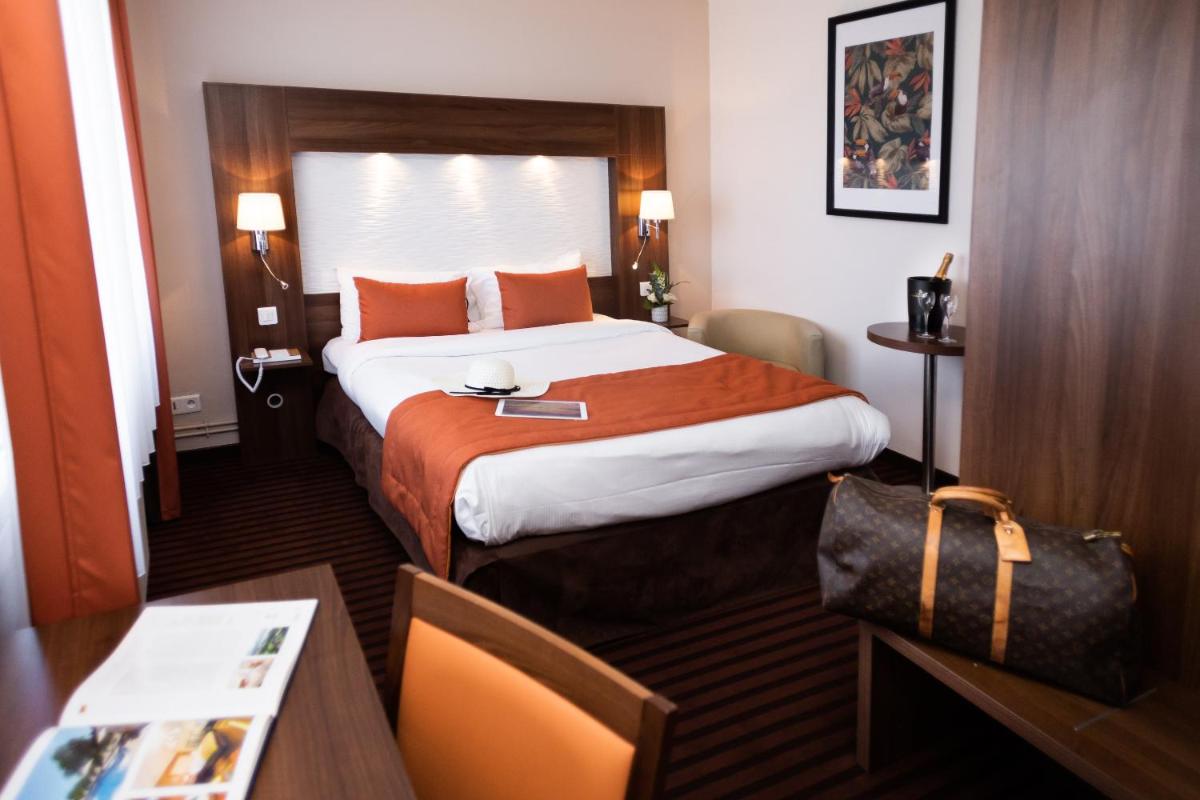 Un ou plusieurs lits dans un hébergement de l'établissement Hotel Regina & Spa