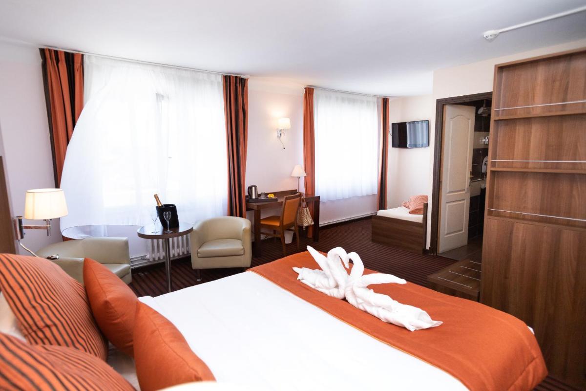 Un ou plusieurs lits dans un hébergement de l'établissement Hotel Regina & Spa