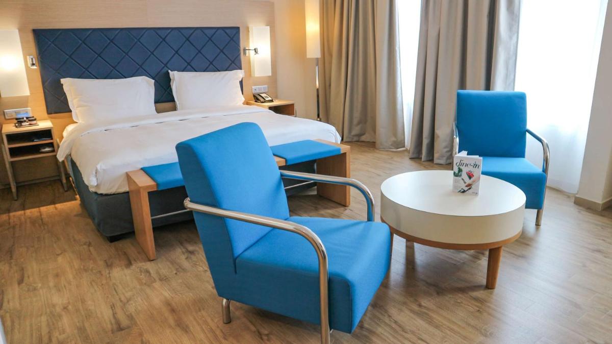 Un ou plusieurs lits dans un hébergement de l'établissement Radisson Blu Hotel Toulouse Airport
