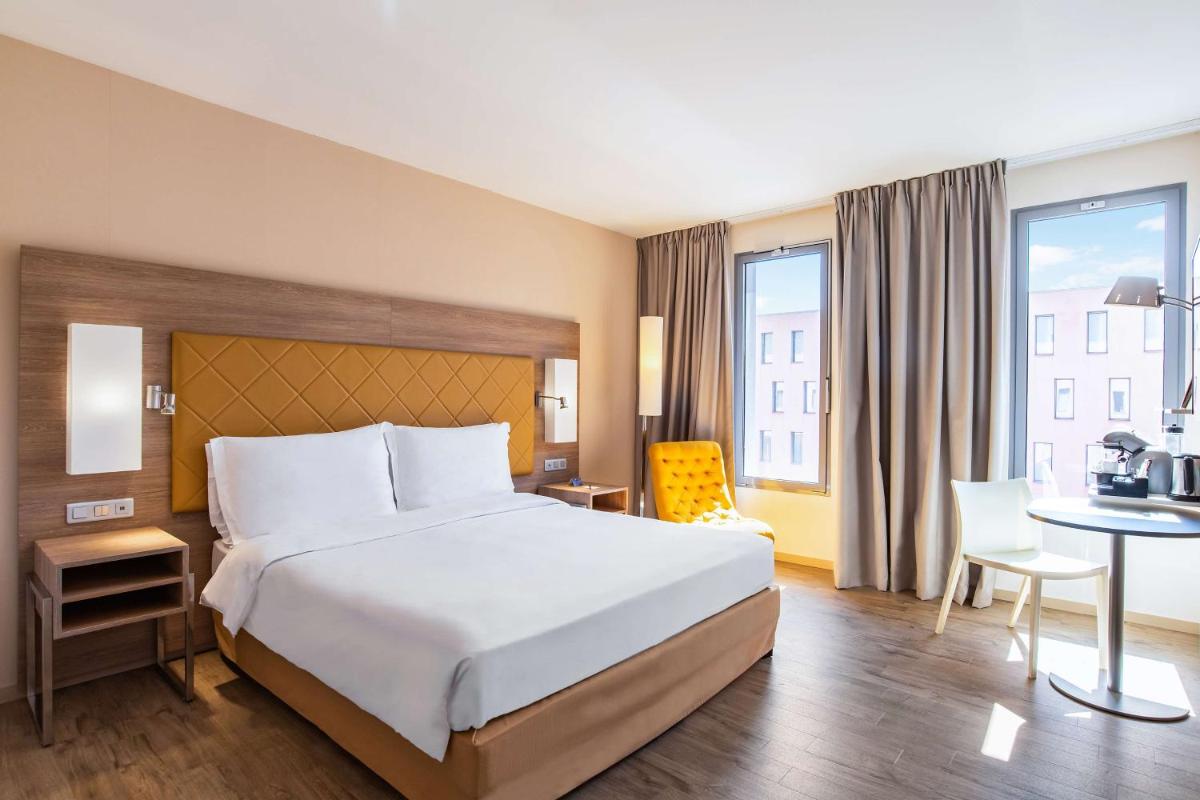Un ou plusieurs lits dans un hébergement de l'établissement Radisson Blu Hotel Toulouse Airport