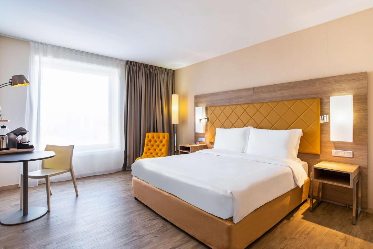 Un ou plusieurs lits dans un hébergement de l'établissement Radisson Blu Hotel Toulouse Airport