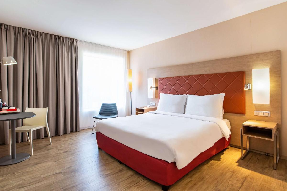 Un ou plusieurs lits dans un hébergement de l'établissement Radisson Blu Hotel Toulouse Airport