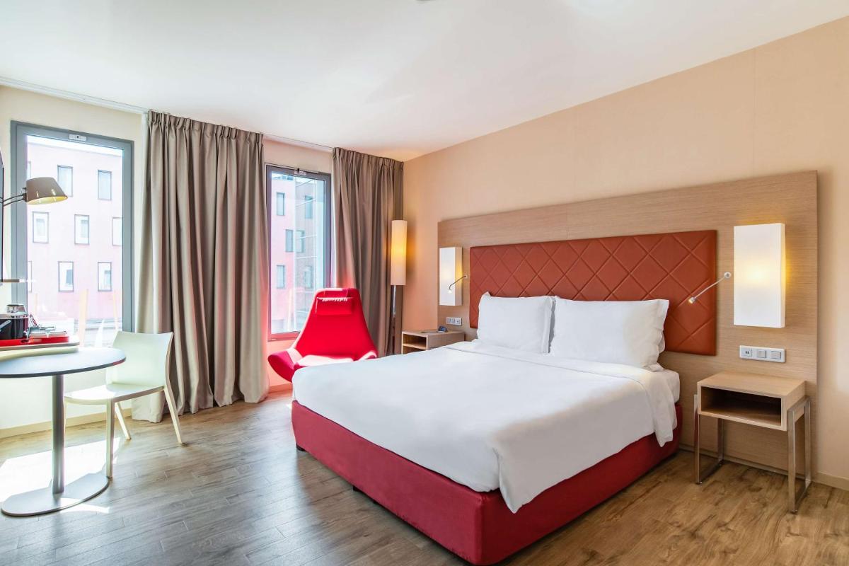 Un ou plusieurs lits dans un hébergement de l'établissement Radisson Blu Hotel Toulouse Airport