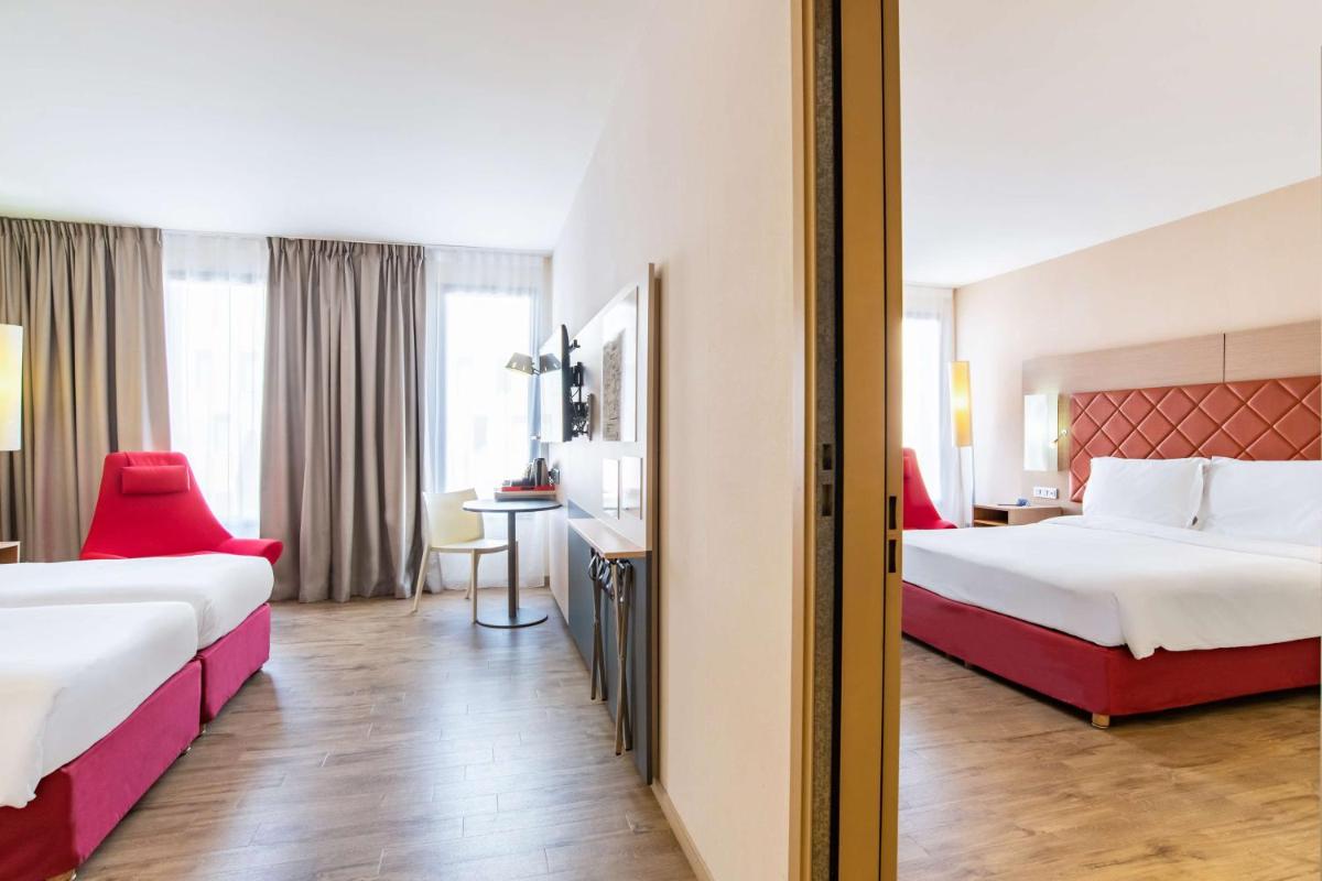 Un ou plusieurs lits dans un hébergement de l'établissement Radisson Blu Hotel Toulouse Airport