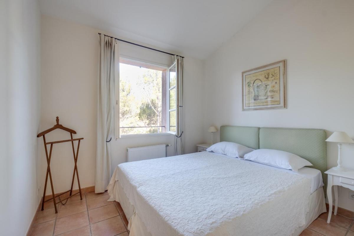 Un ou plusieurs lits dans un hébergement de l'établissement Les Appartements et Maisons du Domaine de Saint Endréol Golf & Spa Resort