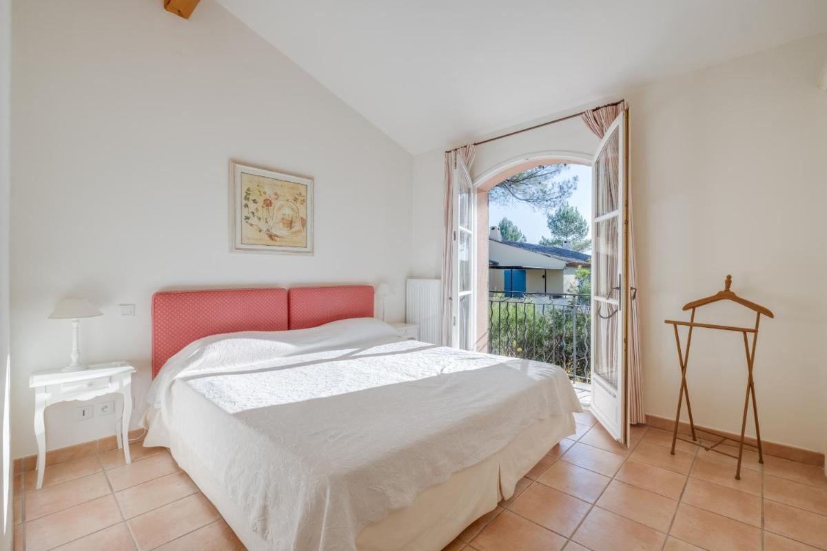 Un ou plusieurs lits dans un hébergement de l'établissement Les Appartements et Maisons du Domaine de Saint Endréol Golf & Spa Resort